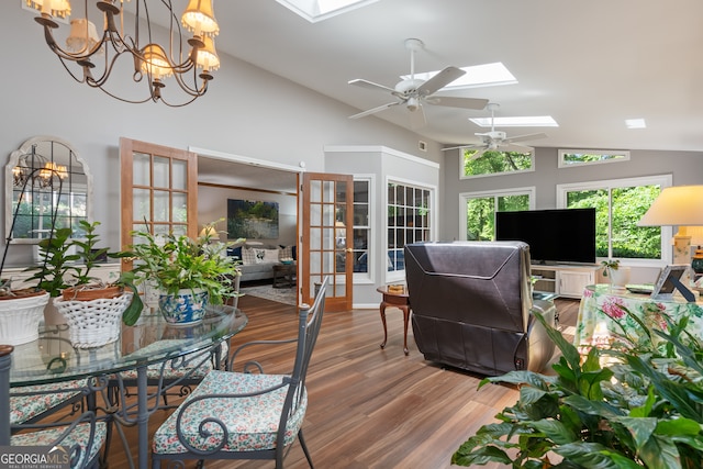 1850 Linnet Ct NE, Roswell, GA 30075 - living room with a skylight, ceiling fan, wood finished floors, french doors, and a chandelier