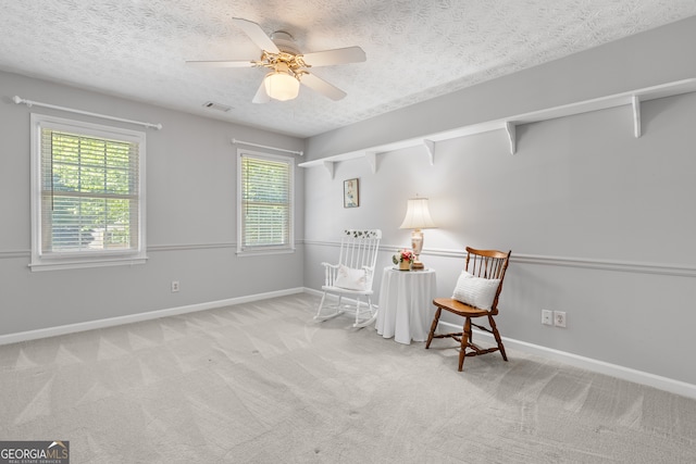 1850 Linnet Ct NE, Roswell, GA 30075 - living area featuring healthy amount of natural light, carpet, baseboards, ceiling fan, and a textured ceiling