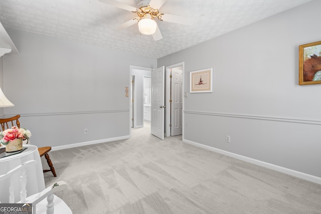 1850 Linnet Ct NE, Roswell, GA 30075 - unfurnished bedroom with carpet floors, a textured ceiling, baseboards, and a ceiling fan