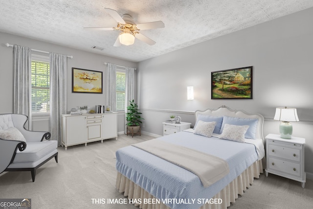 1850 Linnet Ct NE, Roswell, GA 30075 - bedroom with light colored carpet, multiple windows, ceiling fan, a textured ceiling, and baseboards