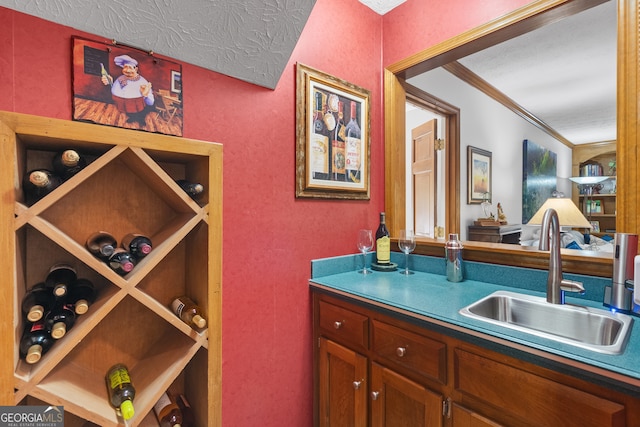 1850 Linnet Ct NE, Roswell, GA 30075 - wine room featuring a sink, a textured wall, and a textured ceiling