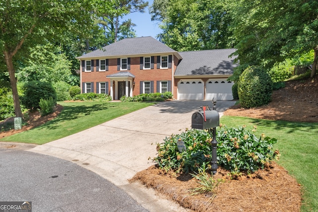 1850 Linnet Ct NE, Roswell, GA 30075 - view of front facade featuring driveway, a garage, a front lawn, and brick siding