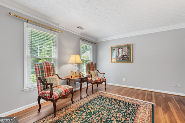 1850 Linnet Ct NE, Roswell, GA 30075 - sitting room featuring wood finished floors, a textured ceiling, crown molding, and baseboards