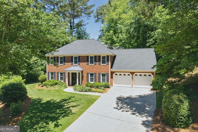 1850 Linnet Ct NE, Roswell, GA 30075 - colonial home featuring a garage, driveway, brick siding, a front lawn, and roof with shingles