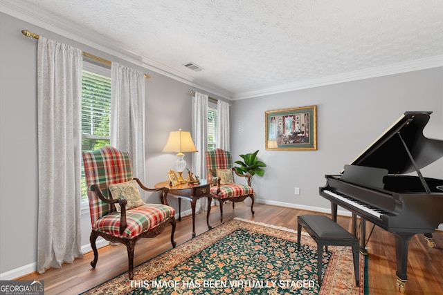 1850 Linnet Ct NE, Roswell, GA 30075 - sitting room featuring wood finished floors, plenty of natural light, a textured ceiling, baseboards, and ornamental molding