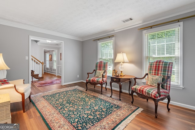 1850 Linnet Ct NE, Roswell, GA 30075 - living area featuring wood finished floors, stairway, ornamental molding, and baseboards