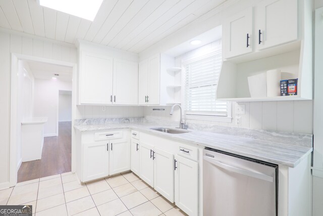 215 E Main St, Hahira, GA 31632 - kitchen featuring open shelves, stainless steel dishwasher, a sink, and light tile patterned floors