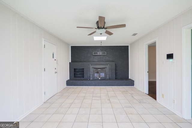 215 E Main St, Hahira, GA 31632 - unfurnished living room with ceiling fan and a large fireplace