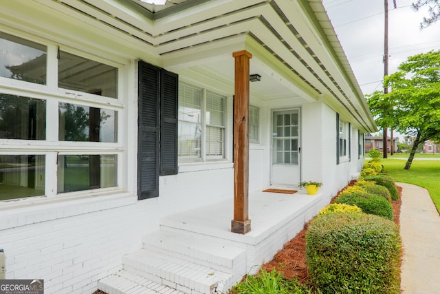 215 E Main St, Hahira, GA 31632 - view of side of home with a porch and brick siding