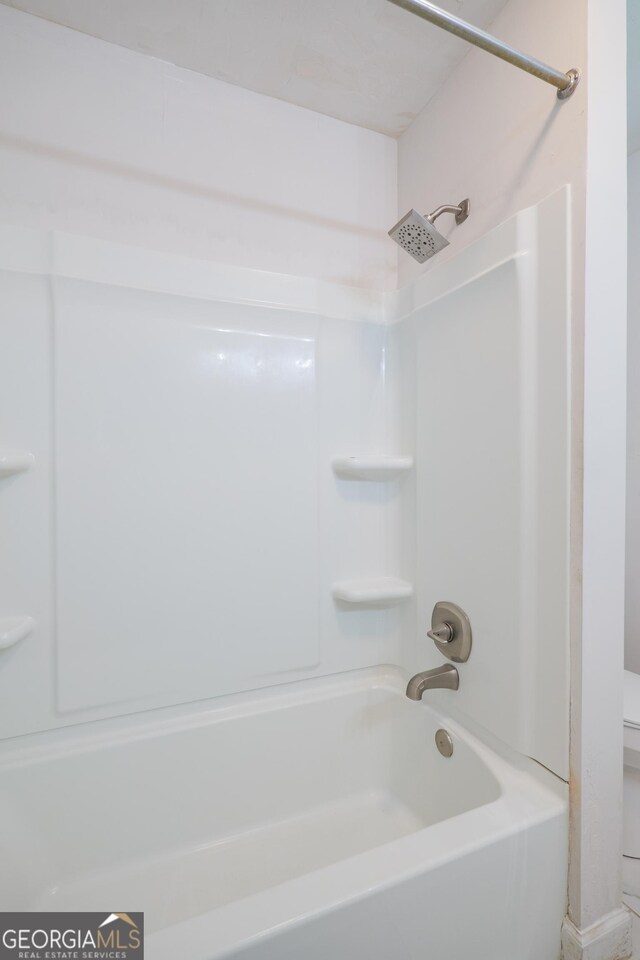 215 E Main St, Hahira, GA 31632 - full bathroom featuring  shower combination and toilet
