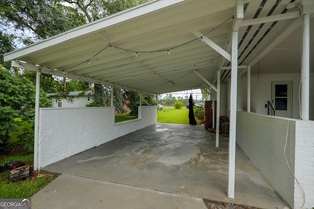 215 E Main St, Hahira, GA 31632 - view of vehicle parking featuring a carport