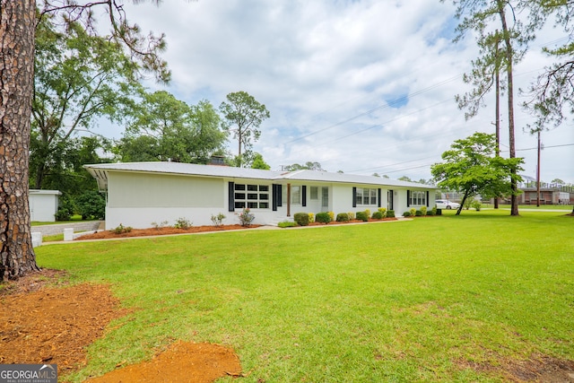 215 E Main St, Hahira, GA 31632 - ranch-style home featuring a front lawn