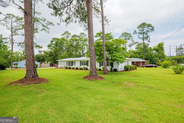 215 E Main St, Hahira, GA 31632 - view of front of property featuring a front lawn