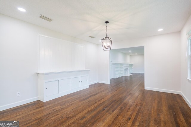 215 E Main St, Hahira, GA 31632 - unfurnished dining area featuring dark wood-type flooring, a chandelier, baseboards, and recessed lighting