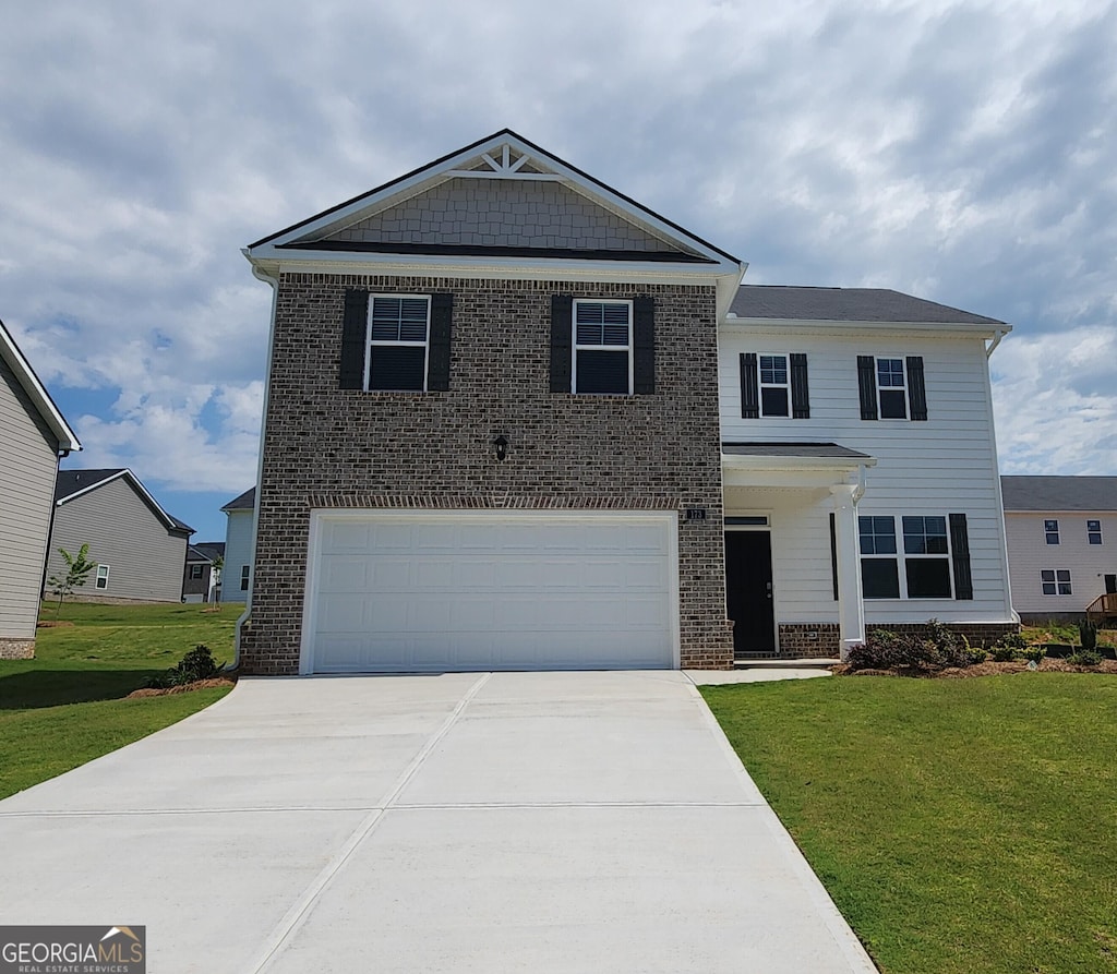 173 Aster Ave, Locust Grove, GA 30248 - view of front of house featuring brick siding, a front lawn, and driveway