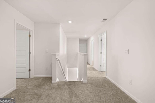 173 Aster Ave, Locust Grove, GA 30248 - hall featuring an upstairs landing, carpet floors, baseboards, and recessed lighting