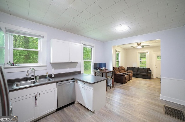 430 Sherwood Cir, Danielsville, GA 30633 - kitchen featuring dishwasher, dark countertops, white cabinetry, open floor plan, and a peninsula