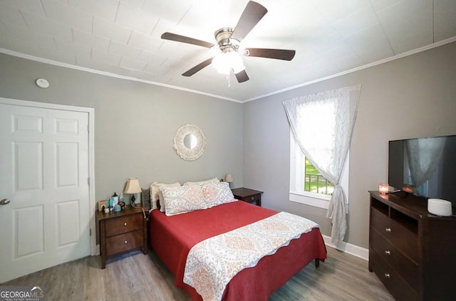 430 Sherwood Cir, Danielsville, GA 30633 - bedroom featuring wood finished floors, ornamental molding, and a ceiling fan