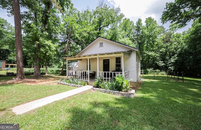 430 Sherwood Cir, Danielsville, GA 30633 - bungalow-style house with covered porch, a front lawn, and view of scattered trees