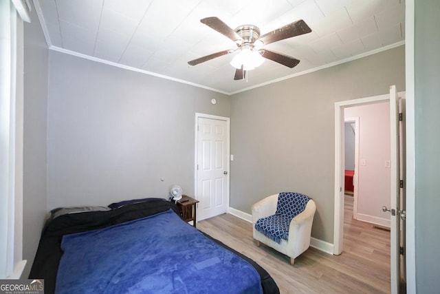 430 Sherwood Cir, Danielsville, GA 30633 - bedroom featuring crown molding, light wood-style flooring, and a ceiling fan