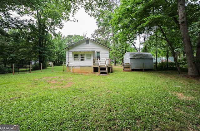 430 Sherwood Cir, Danielsville, GA 30633 - rear view of house with a yard, crawl space, and a shed