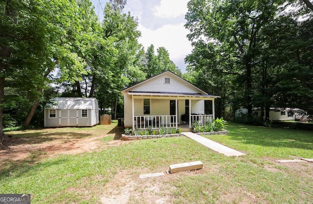 430 Sherwood Cir, Danielsville, GA 30633 - bungalow-style home featuring a porch, a shed, and a front yard
