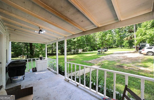 430 Sherwood Cir, Danielsville, GA 30633 - covered porch featuring a yard, area for grilling, and view of wooded area