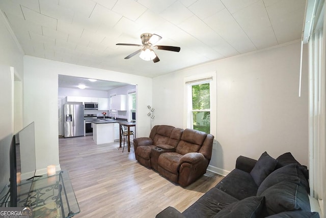 430 Sherwood Cir, Danielsville, GA 30633 - living room featuring a ceiling fan, light wood-style floors, and crown molding