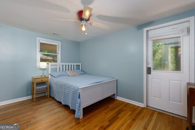 3835 Clubhouse Cir, Gainesville, GA 30501 - bedroom with wood finished floors, baseboards, and ceiling fan