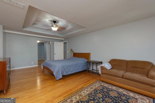 3835 Clubhouse Cir, Gainesville, GA 30501 - bedroom with a raised ceiling, light wood-style floors, baseboards, and a ceiling fan
