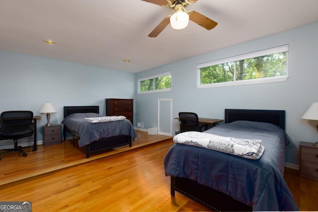 3835 Clubhouse Cir, Gainesville, GA 30501 - bedroom featuring a desk, light wood finished floors, baseboards, and a ceiling fan
