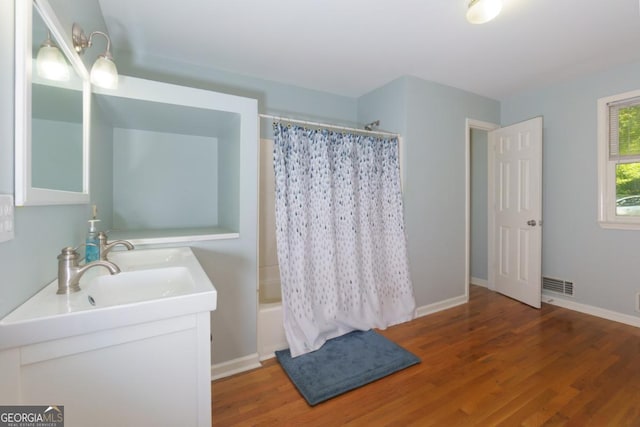 3835 Clubhouse Cir, Gainesville, GA 30501 - bathroom with wood finished floors, double vanity, shower / tub combo with curtain, and baseboards