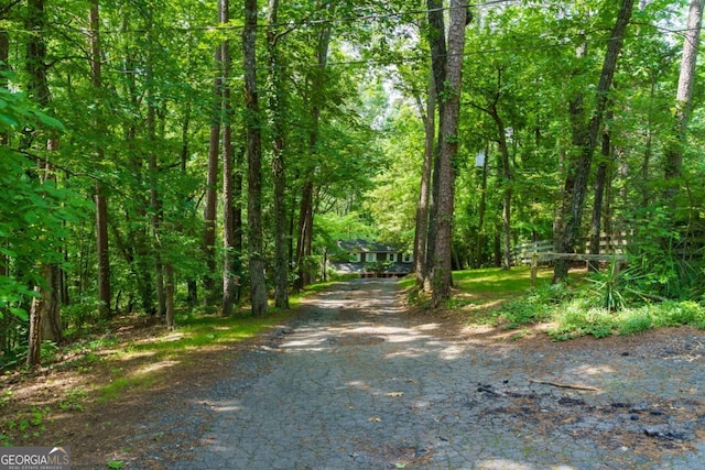 3835 Clubhouse Cir, Gainesville, GA 30501 - view of asphalt driveway featuring a wooded view