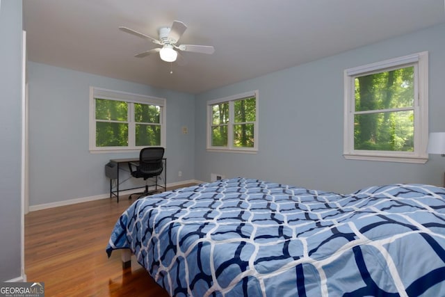 3835 Clubhouse Cir, Gainesville, GA 30501 - bedroom with wood finished floors, baseboards, and a ceiling fan