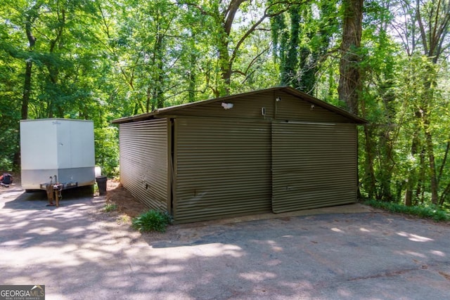3835 Clubhouse Cir, Gainesville, GA 30501 - view of outbuilding with a view of trees