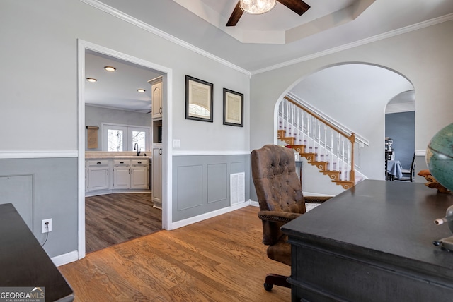 157 Riverbend Cir, Royston, GA 30662 - office featuring ceiling fan, wood finished floors, arched walkways, a sink, and ornamental molding