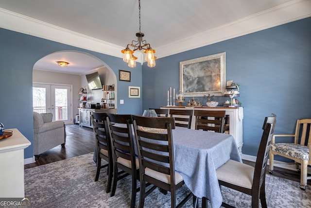 157 Riverbend Cir, Royston, GA 30662 - dining room with arched walkways, ornamental molding, wood finished floors, and a chandelier