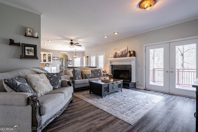 157 Riverbend Cir, Royston, GA 30662 - living area with french doors, crown molding, dark wood-style flooring, a tile fireplace, and recessed lighting