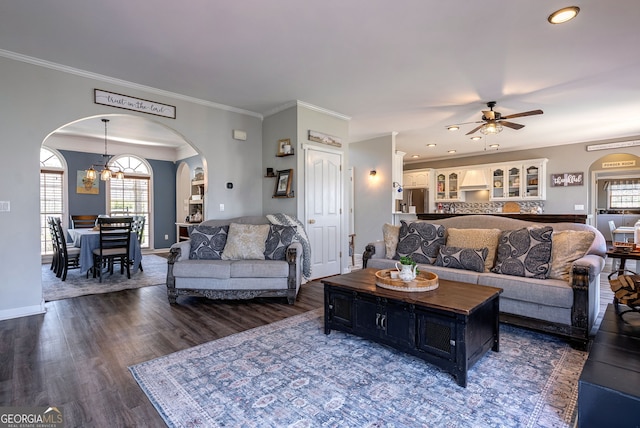 157 Riverbend Cir, Royston, GA 30662 - living room featuring arched walkways, ceiling fan, wood finished floors, baseboards, and a chandelier