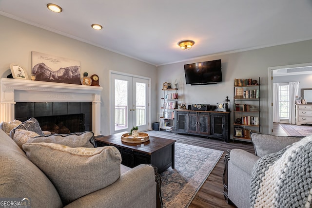 157 Riverbend Cir, Royston, GA 30662 - living room with crown molding, healthy amount of natural light, wood finished floors, a fireplace, and recessed lighting