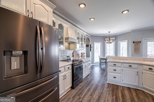 157 Riverbend Cir, Royston, GA 30662 - kitchen featuring refrigerator with ice dispenser, range with electric stovetop, custom exhaust hood, ornamental molding, and light countertops
