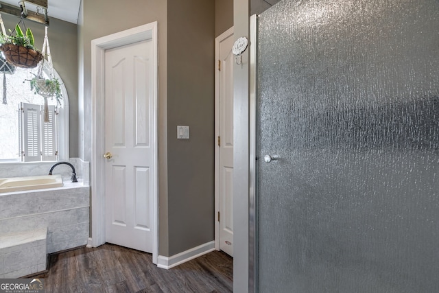 157 Riverbend Cir, Royston, GA 30662 - bathroom featuring wood finished floors and a bath