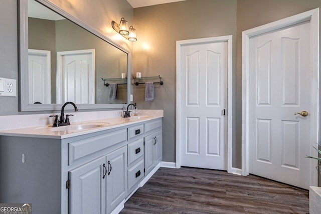 157 Riverbend Cir, Royston, GA 30662 - full bathroom featuring double vanity, wood finished floors, and baseboards