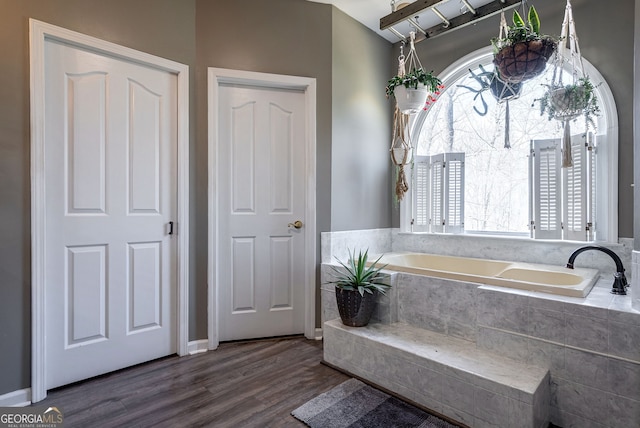 157 Riverbend Cir, Royston, GA 30662 - bathroom featuring a garden tub and wood finished floors