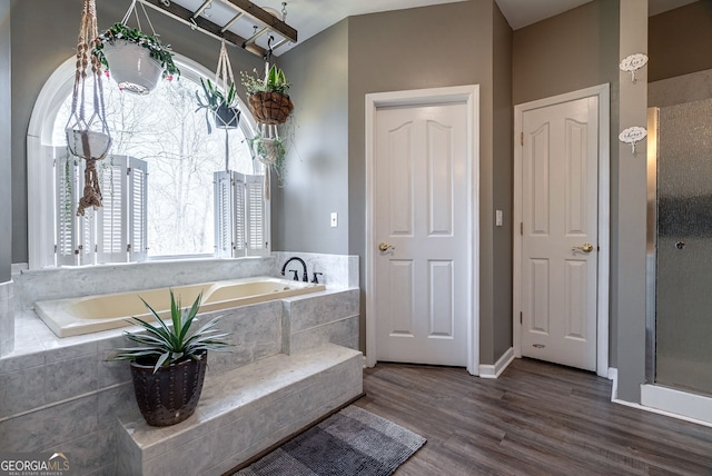 157 Riverbend Cir, Royston, GA 30662 - bathroom with a garden tub and wood finished floors