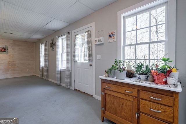 157 Riverbend Cir, Royston, GA 30662 - doorway to outside featuring finished concrete flooring and wooden walls