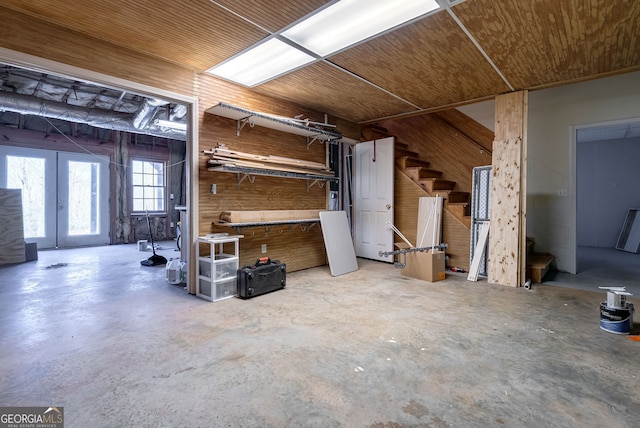 157 Riverbend Cir, Royston, GA 30662 - misc room with unfinished concrete flooring, stairway, wooden ceiling, and wood walls