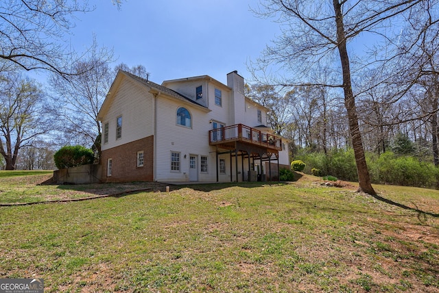 157 Riverbend Cir, Royston, GA 30662 - rear view of house with a chimney, a deck, a lawn, and brick siding