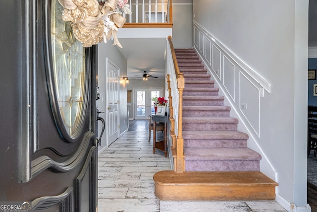 157 Riverbend Cir, Royston, GA 30662 - entryway with stairs, wood finished floors, a ceiling fan, and baseboards