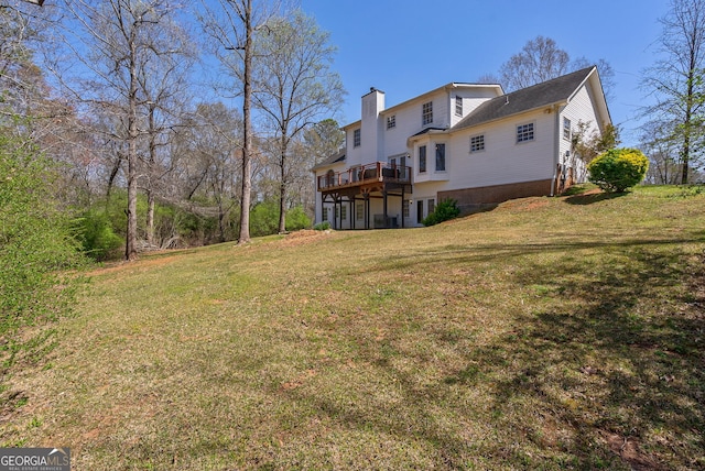 157 Riverbend Cir, Royston, GA 30662 - rear view of house featuring a deck, a lawn, and a chimney